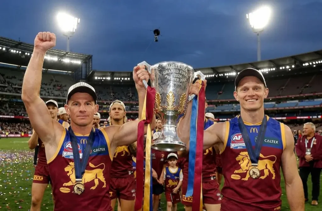 Brisbane Lions Players Walking while Carrying their Trophy 