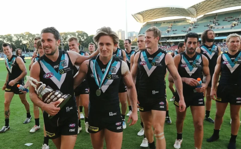 The Port Adelaide Team is Walking with their Trophy 